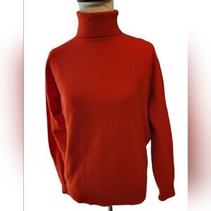 Cashmere vintage sweater in size medium, color red-orange.